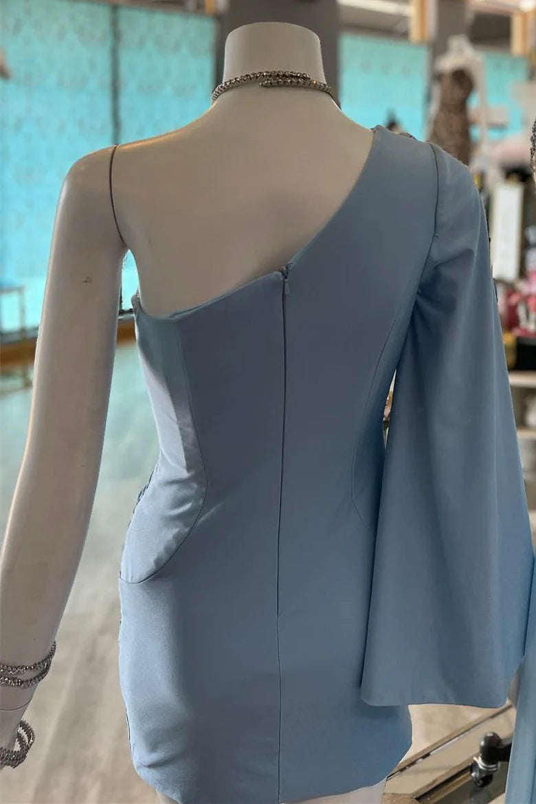 Side view of a model wearing a dusky blue one-shoulder ruched party dress.