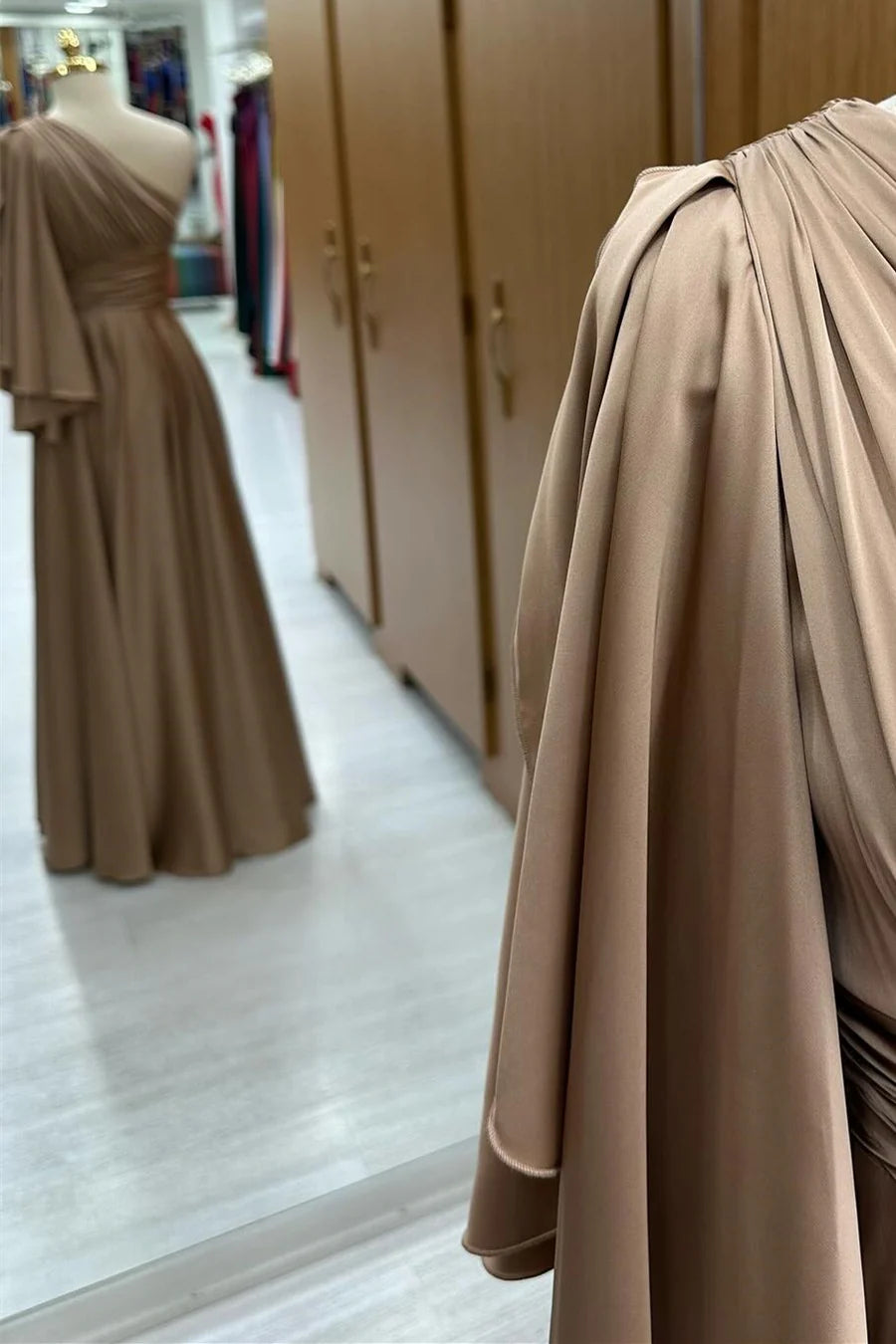 Back view of the champagne A-line long formal dress, showcasing the flowing skirt.