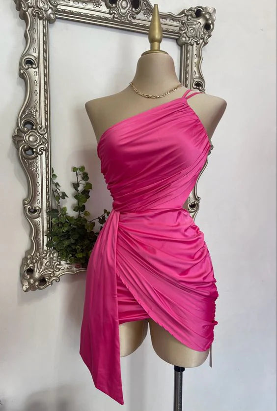Woman in a pink one-shoulder pleated satin short homecoming dress with a cinched waist.