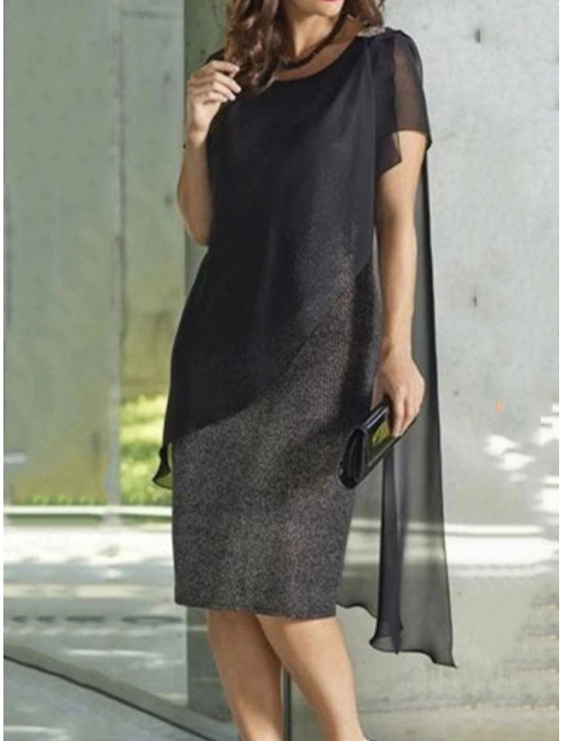 Back view of a woman showcasing the elegant drape of the chiffon midi dress.
