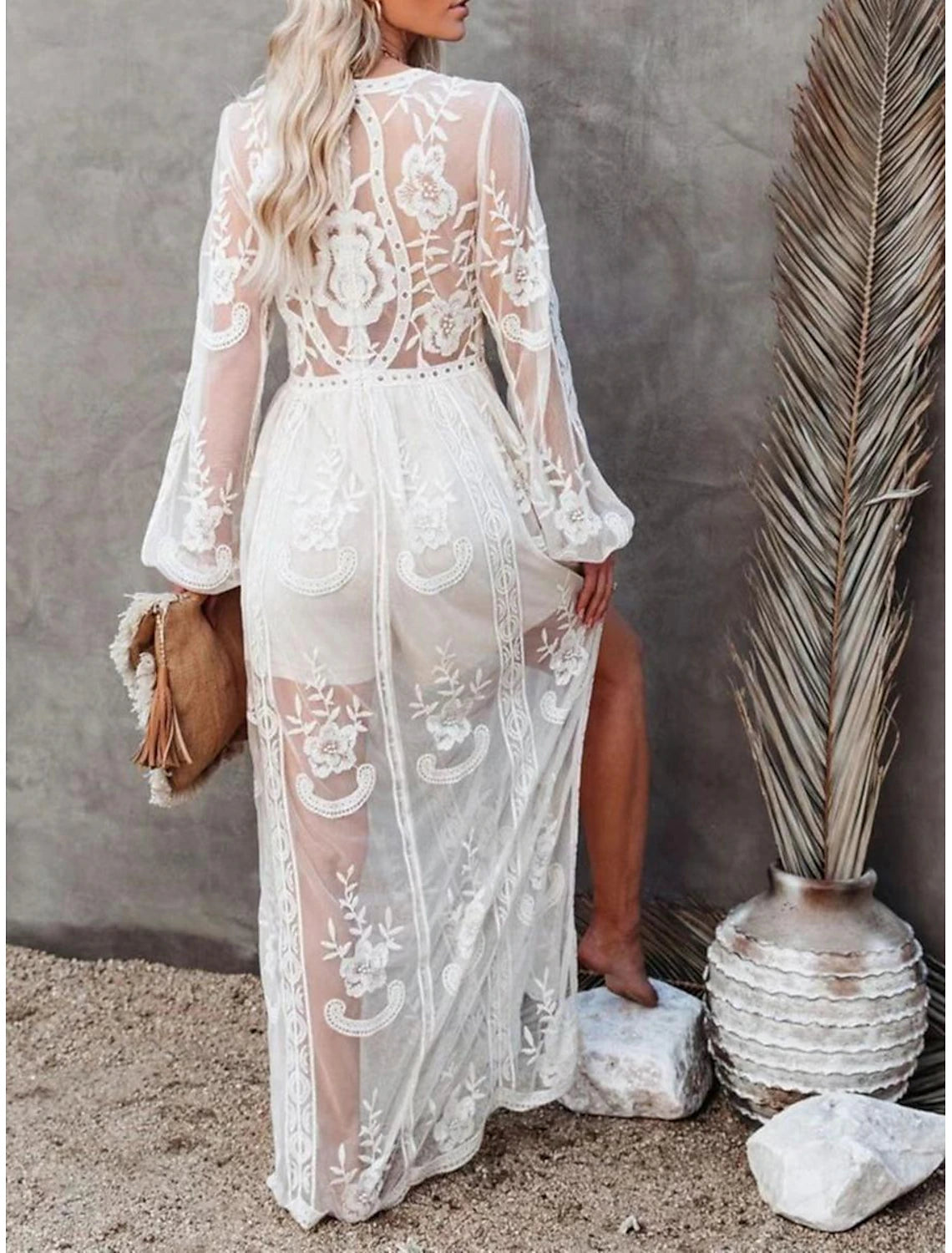 Side view of the elegant white patchwork maxi dress with long sleeves.