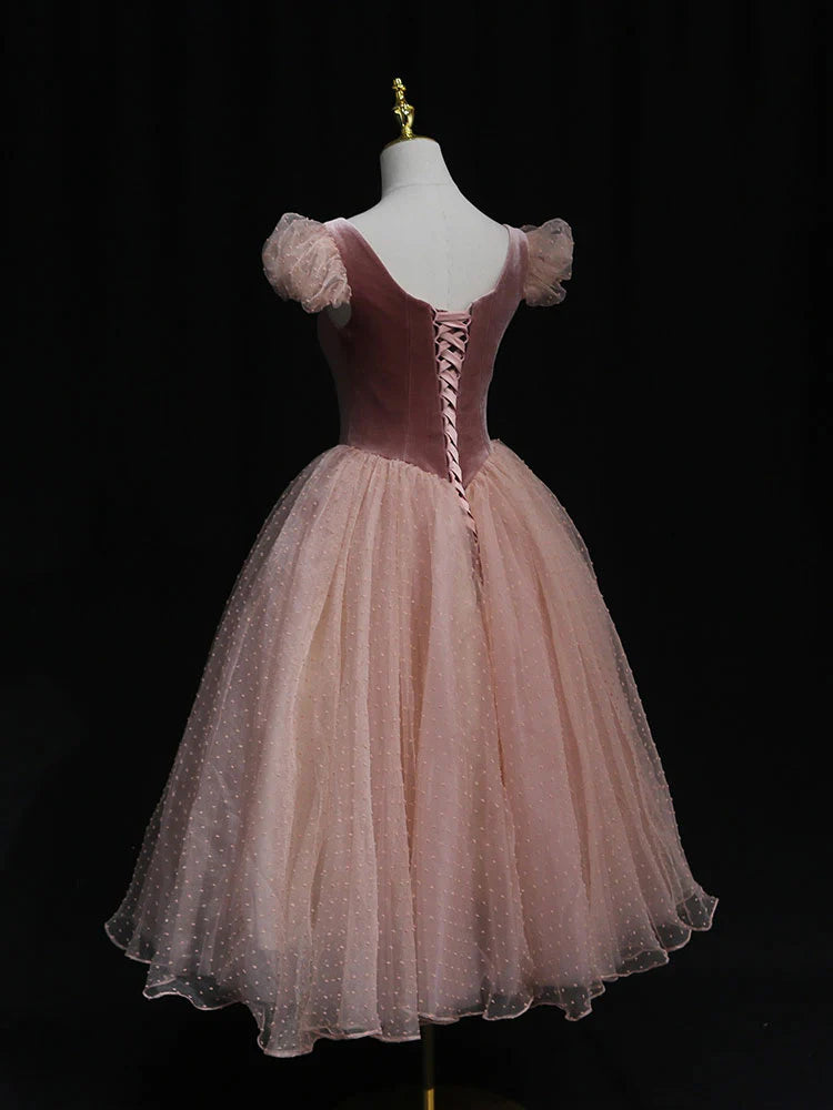 Side view of the pink tulle short homecoming dress, showcasing its A-line silhouette.