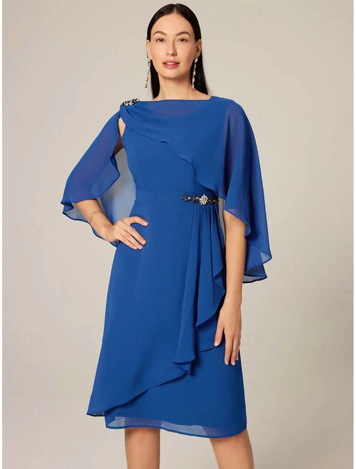 Woman modeling an elegant royal blue plus size chiffon midi dress with ruffle details and a boat neck.