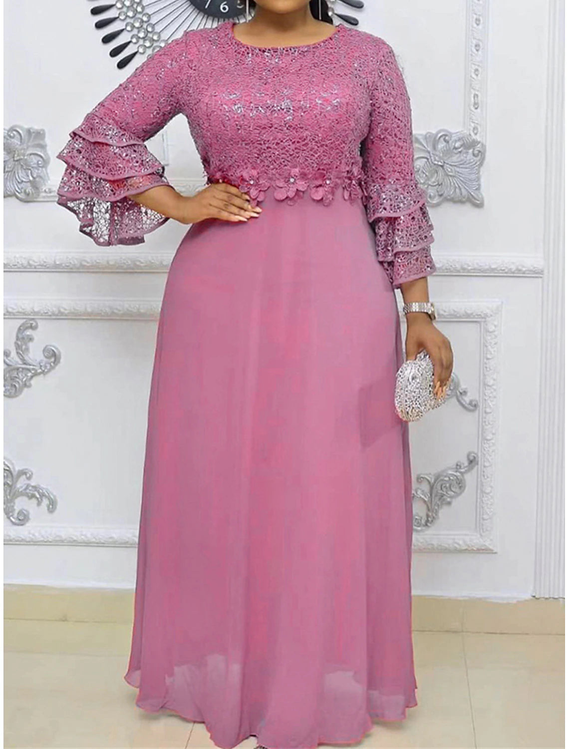 Elegant plus size V-neck lace maxi dress in a studio setting.