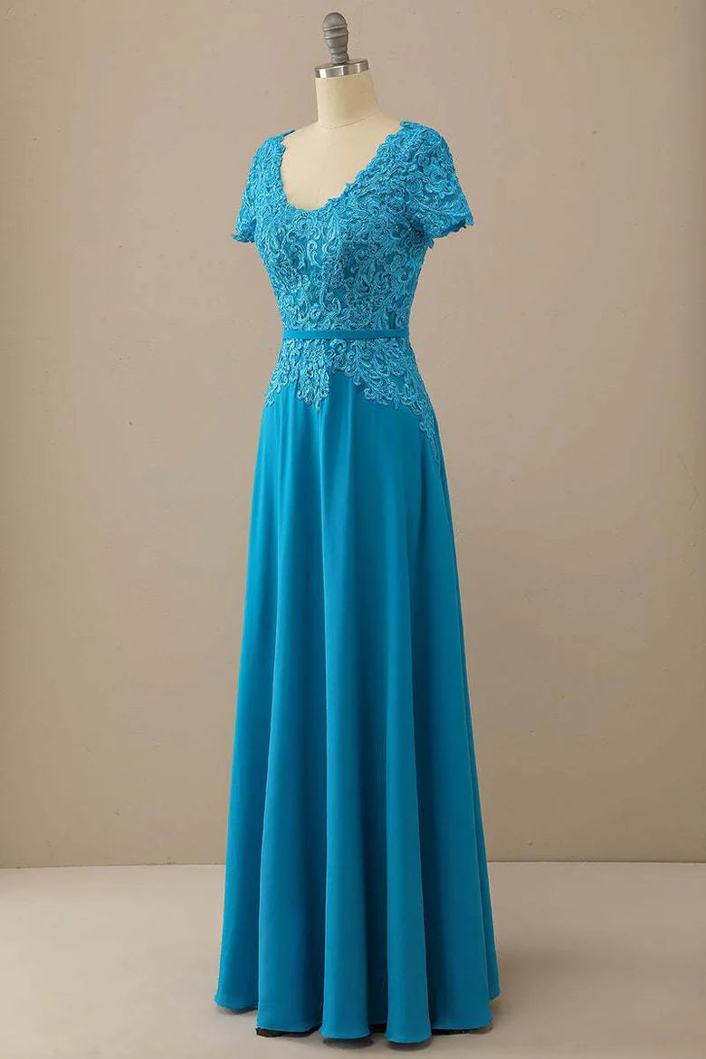 Side view of a woman wearing the blue lace Mother of the Bride gown.