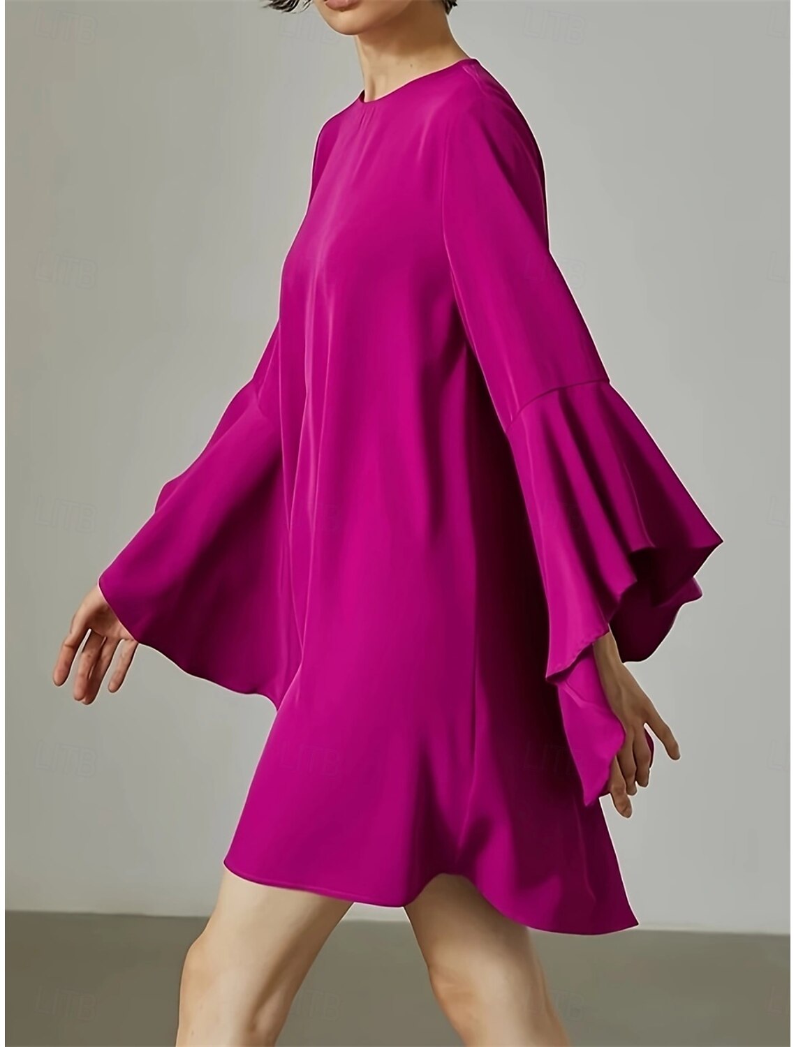 Stylish pink long sleeve mini dress for women, shown from a different angle.