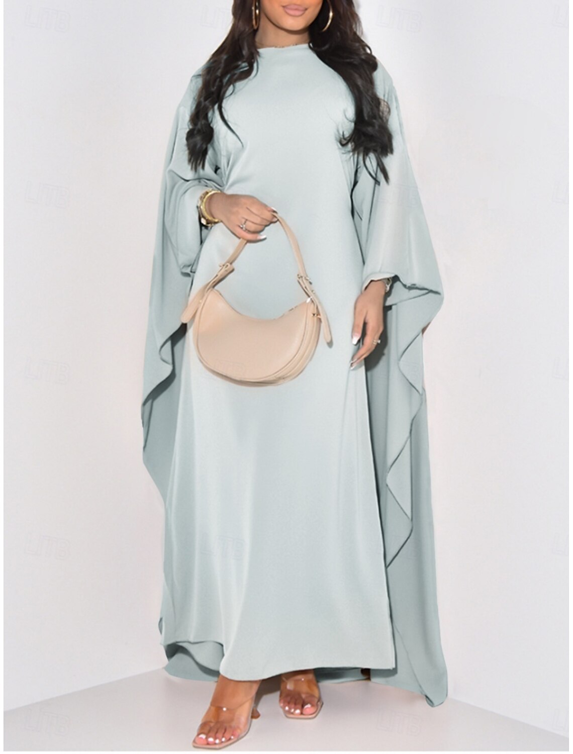 Side view of a woman in a regular fit midi dress with short sleeves.