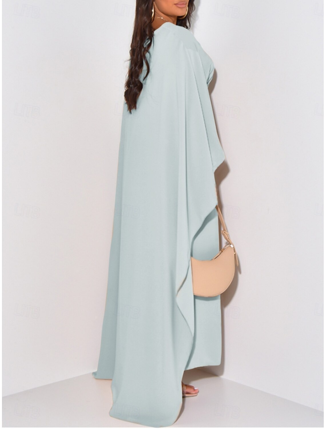Back view of a woman in a plain crew neck midi dress.