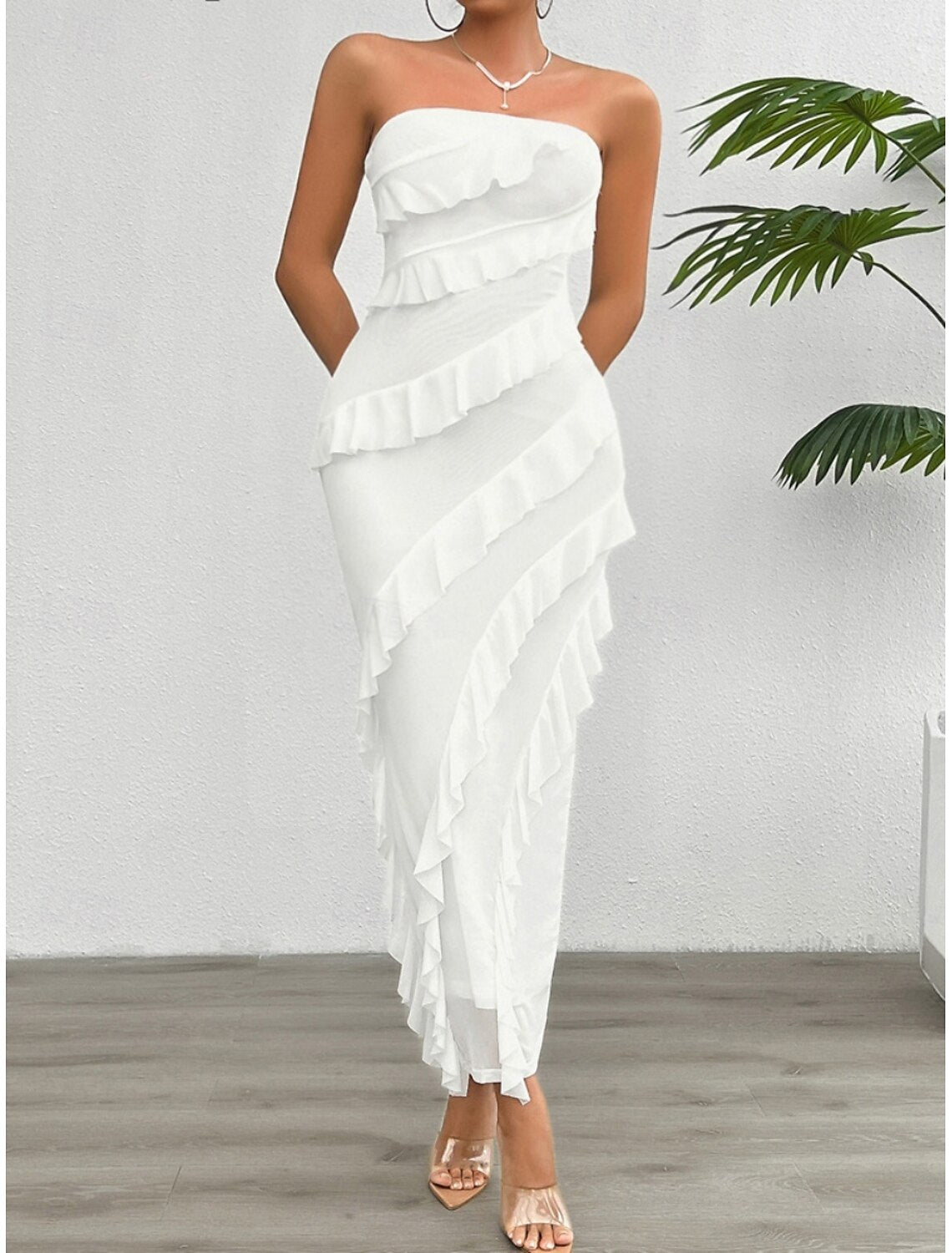 Model wearing an elegant white off-shoulder strapless prom dress.