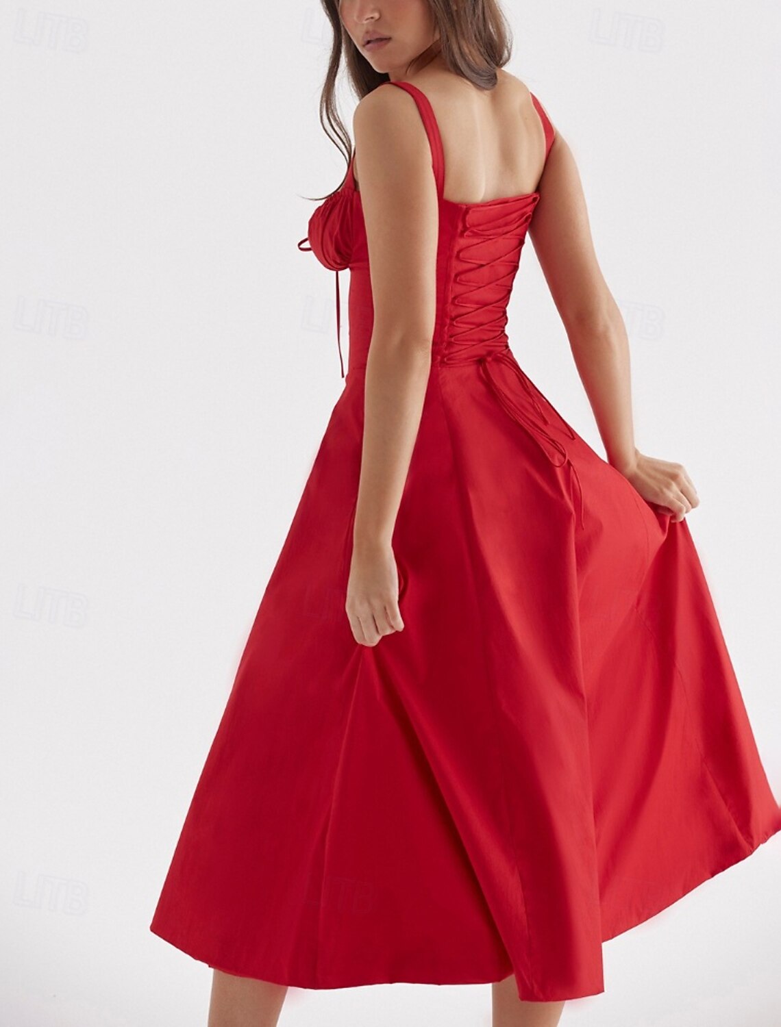 Close-up of the U-neckline and fabric detail of the white midi dress.