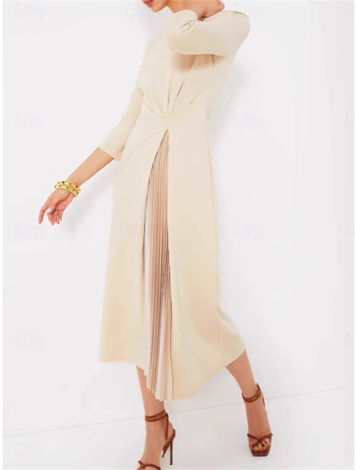 Side view of woman in apricot midi dress, showcasing the A-line silhouette.