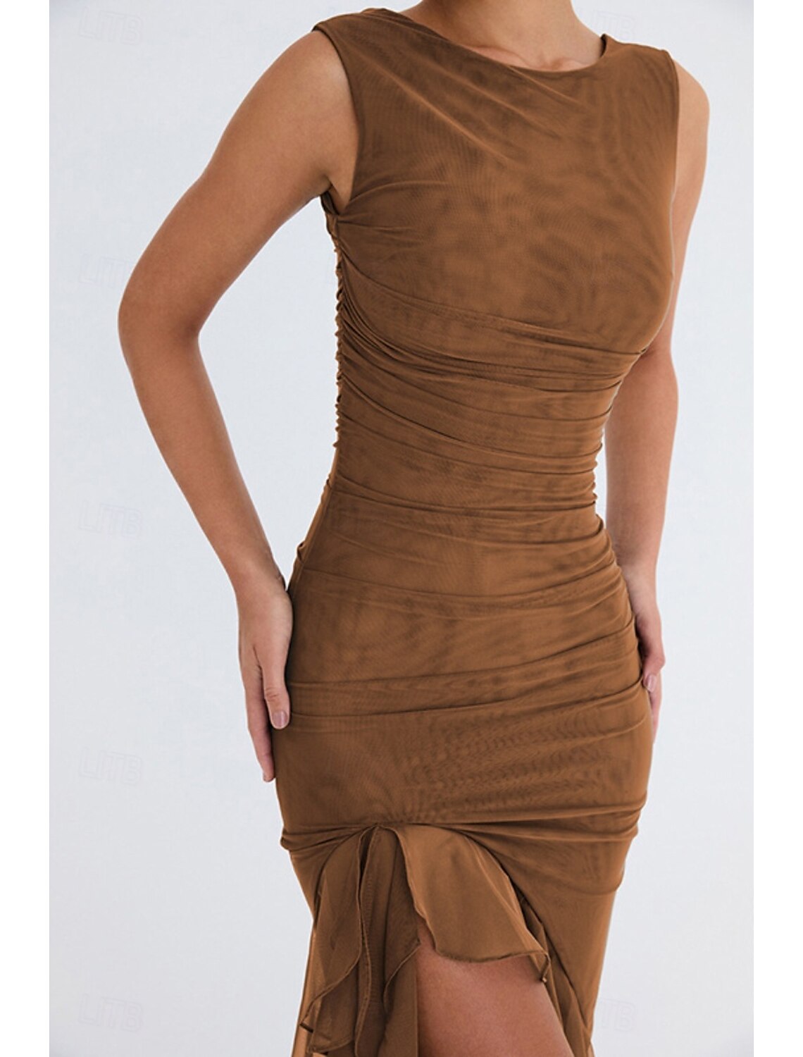 Model posing in a sleeveless ruched midi dress, showcasing its silhouette.