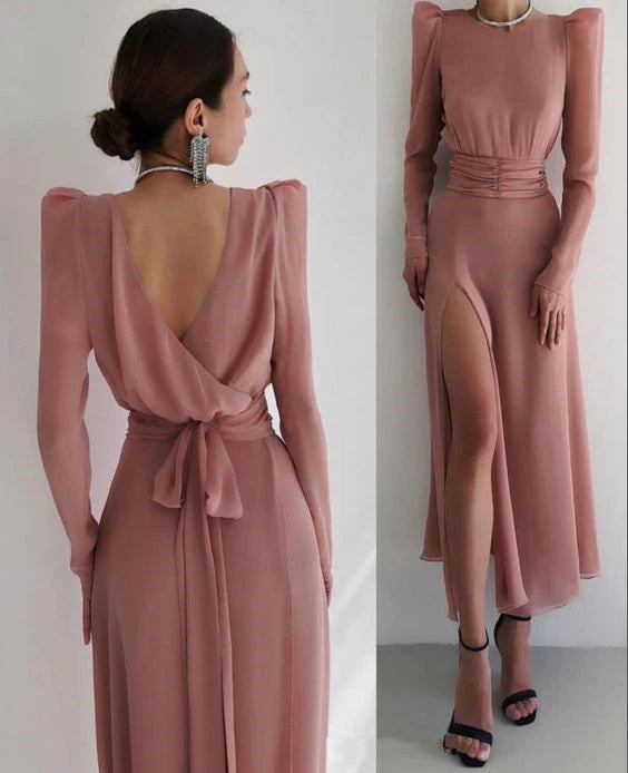 Close-up of the satin fabric on a long sleeve evening gown.