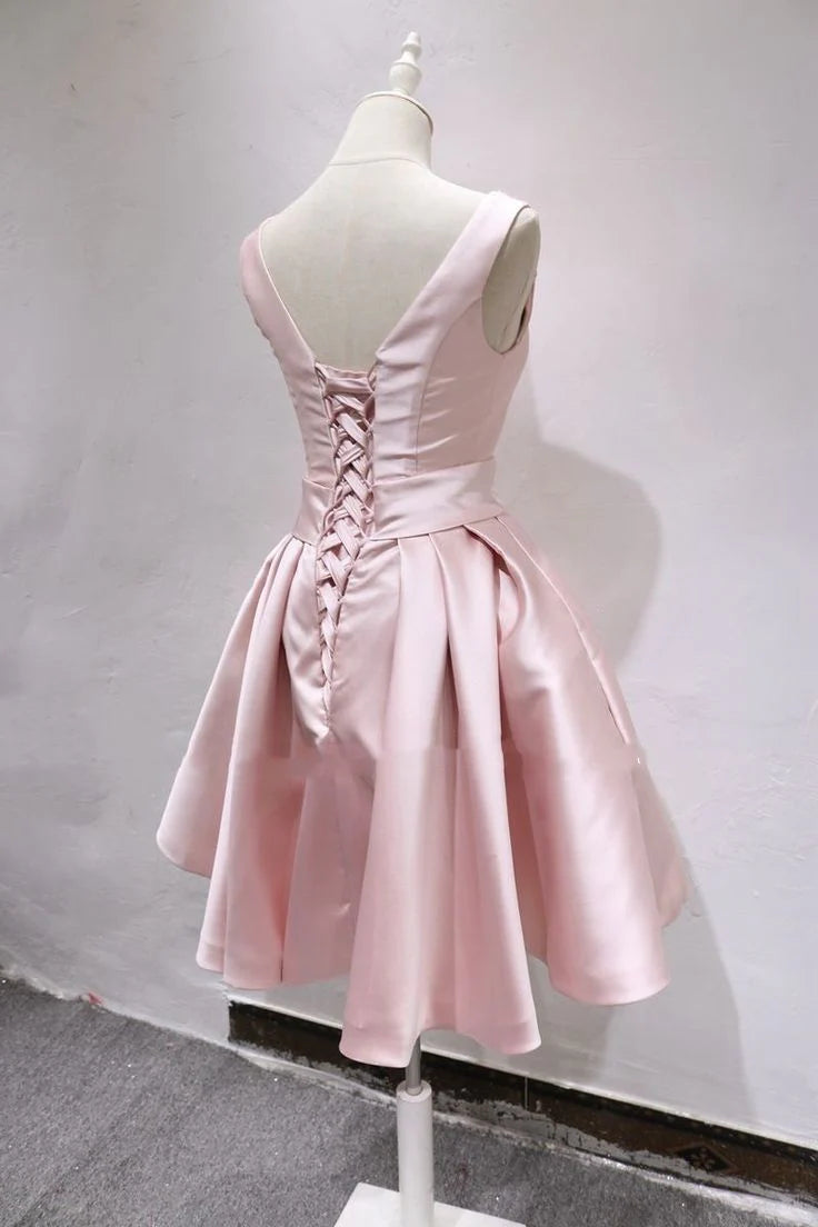 Full-length view of a woman in a sophisticated satin homecoming dress with O-neck and beads.