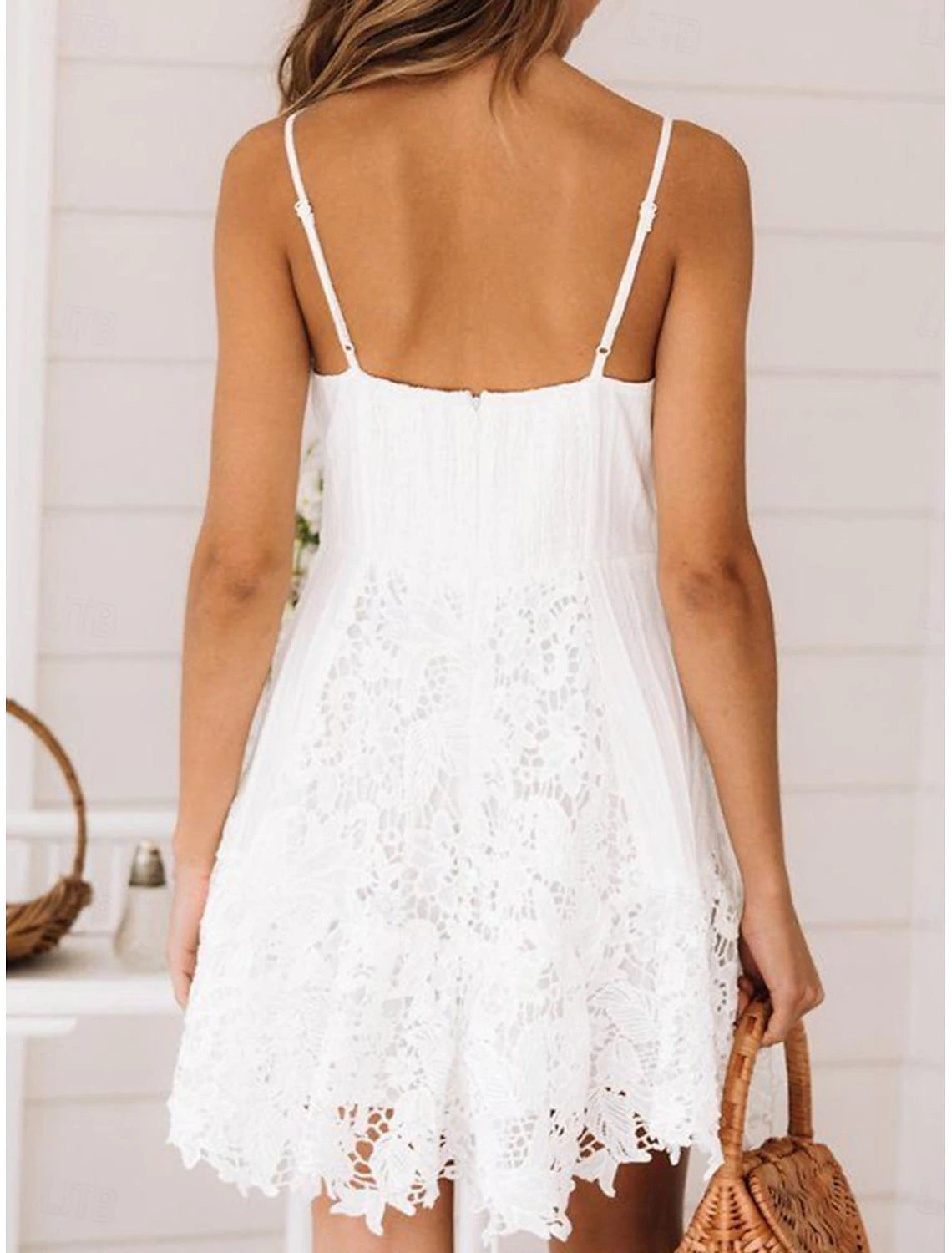 Side view of a woman showcasing the white lace regular fit homecoming dress.