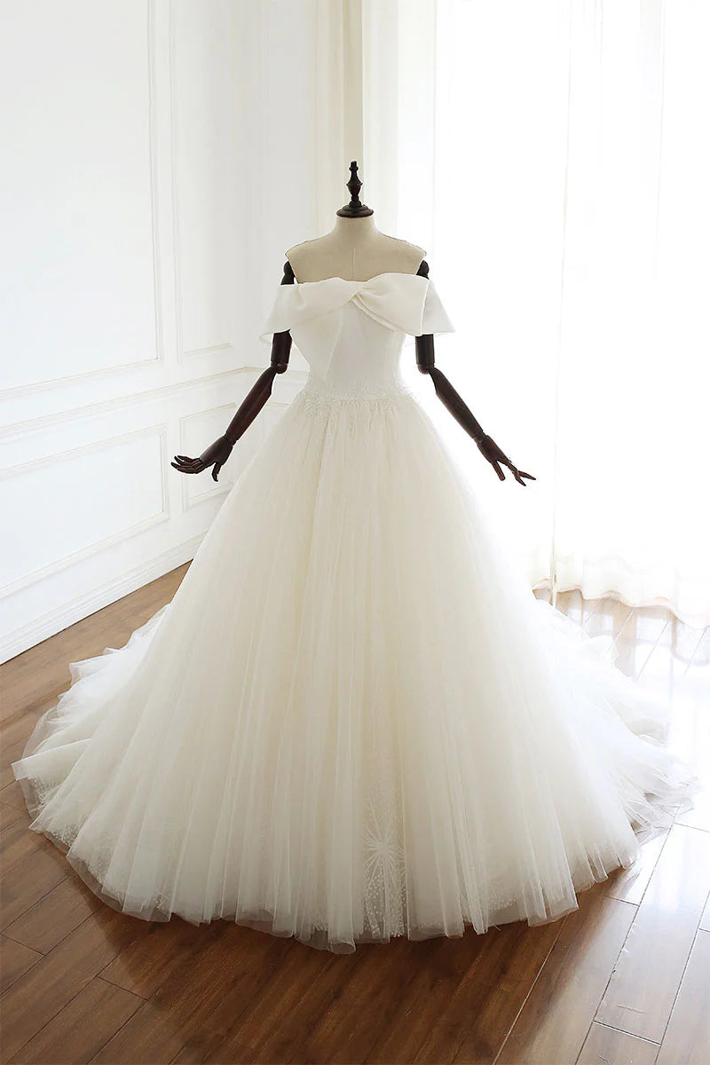 Full length view of an elegant white tulle long wedding gown.