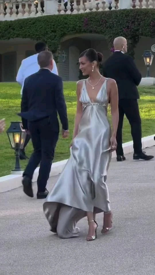 Close-up of the backless design on a black evening dress.