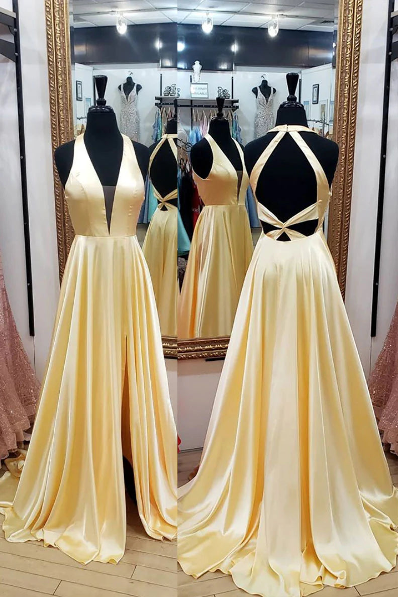 Woman wearing an elegant yellow satin long prom dress with a plunge V-neck and slim-fit silhouette.