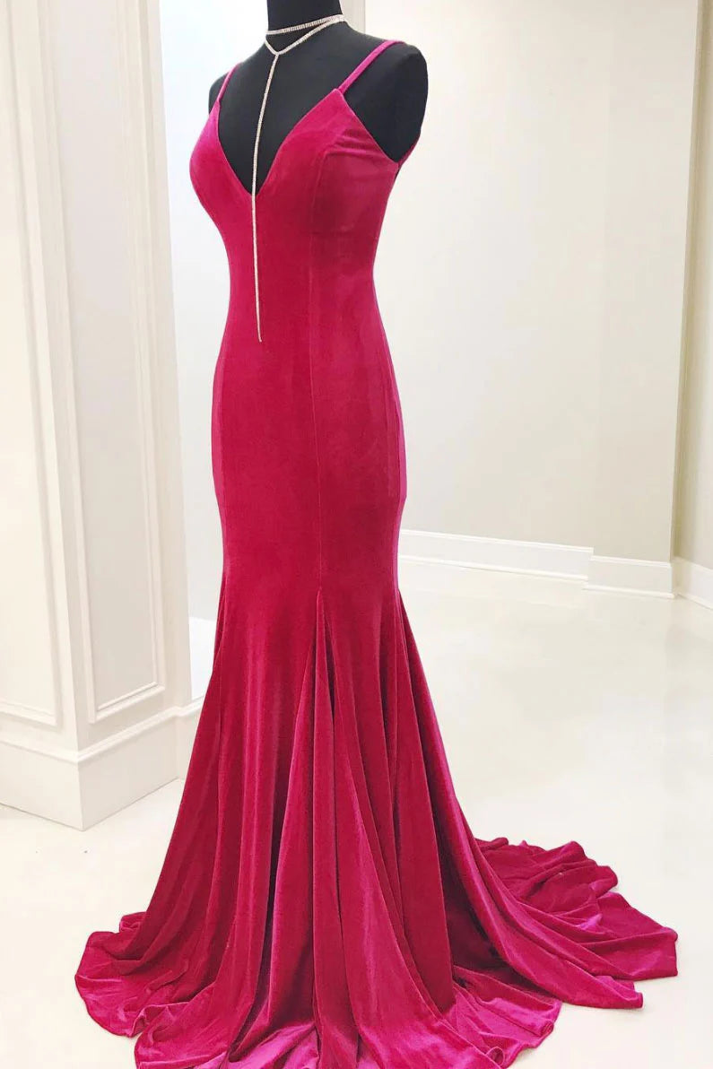 Woman wearing a red V-neck mermaid long prom dress.