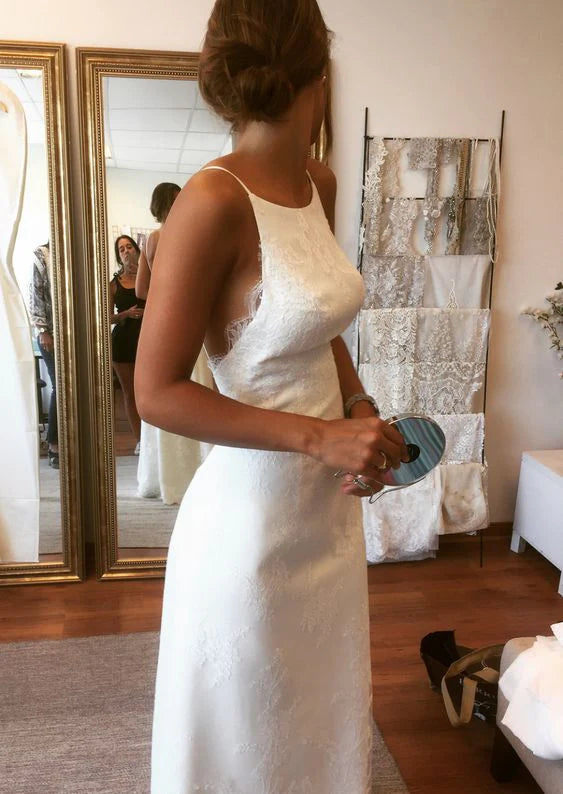 Back view of the lace detailing and spaghetti straps on the wedding dress.