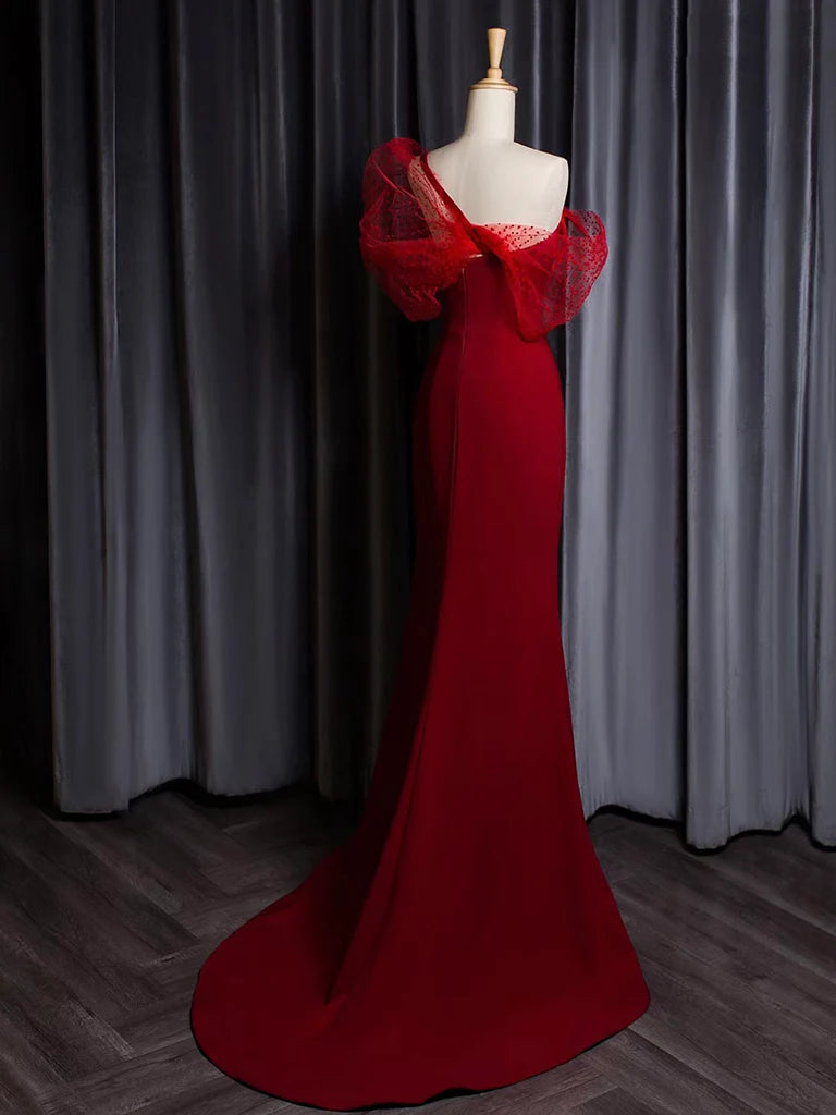Back view of the burgundy one-shoulder mermaid gown, highlighting the elegant train.