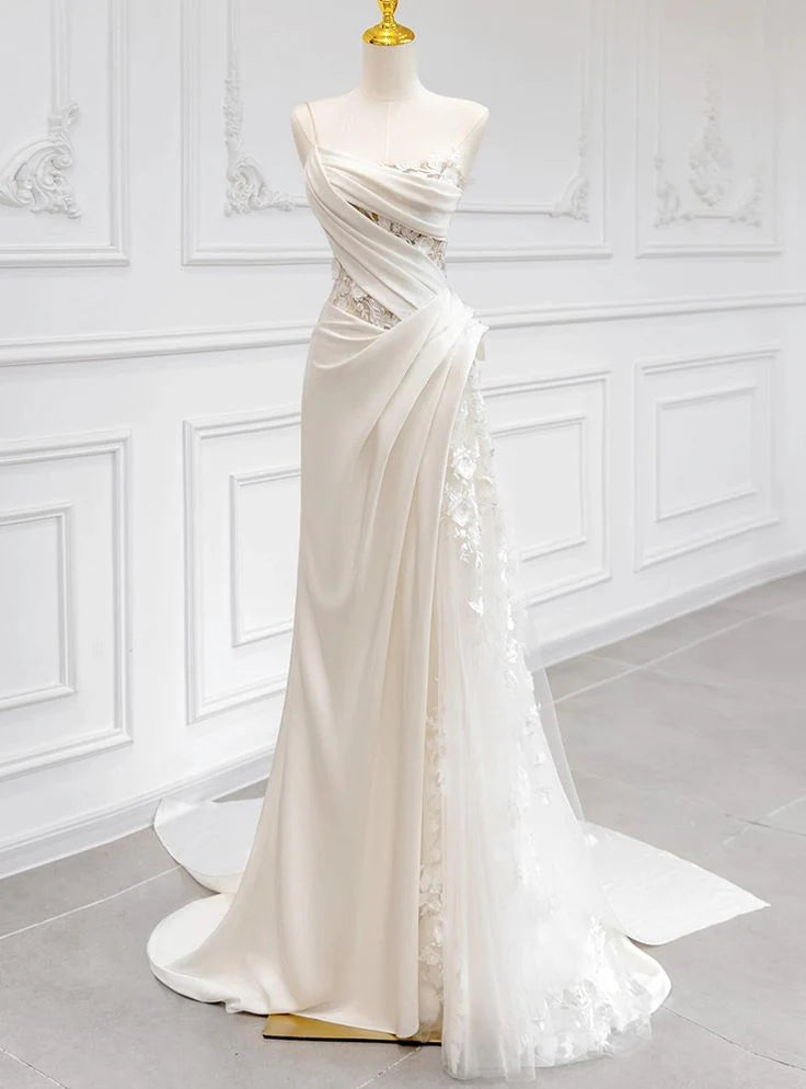 Elegant one-shoulder lace wedding dress with pleated details.