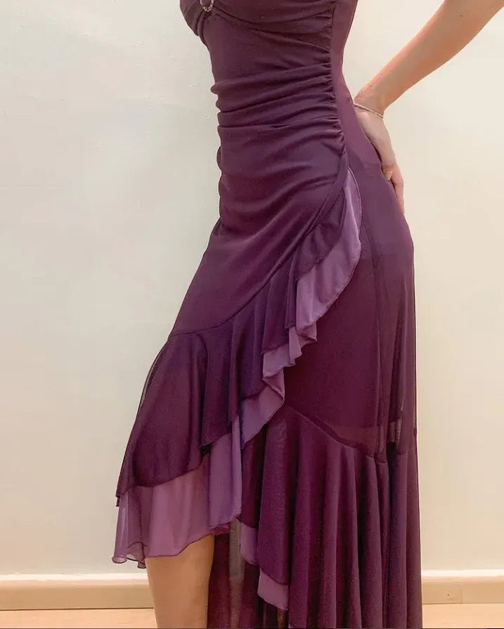 Side view of a woman wearing the purple slim-fit party dress.
