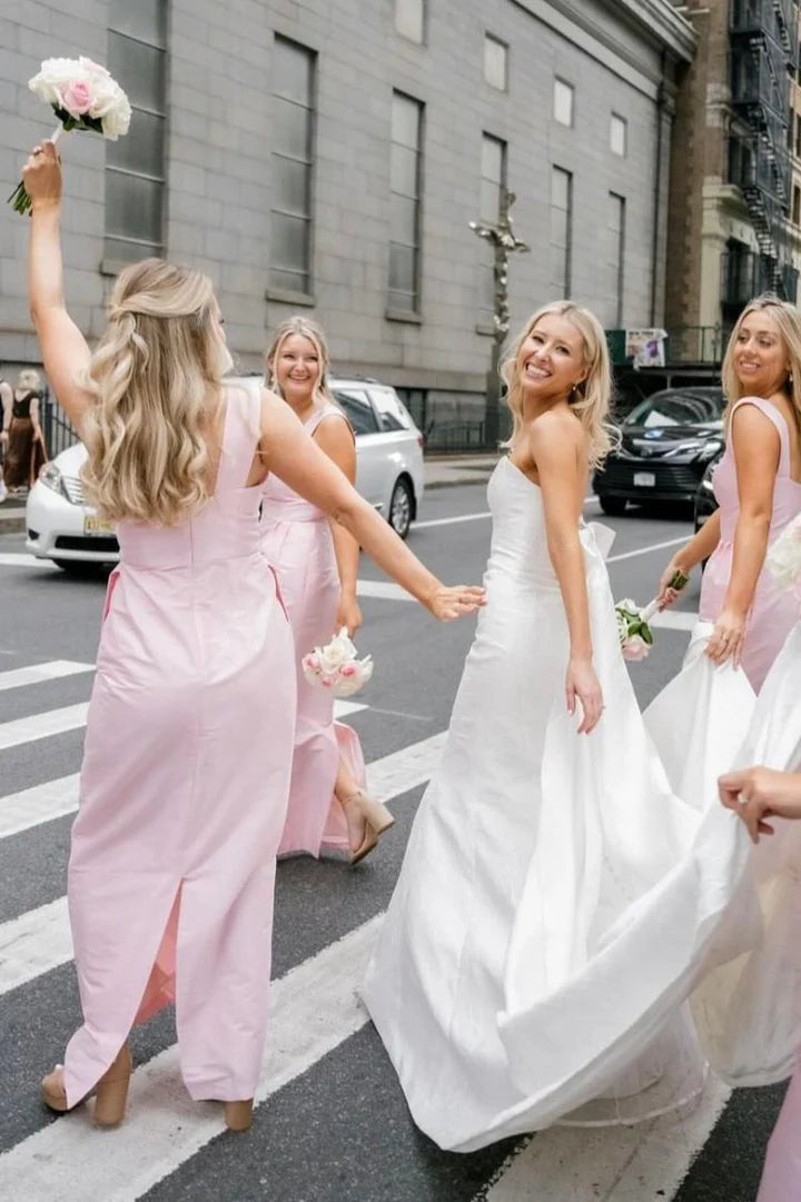 Side view of the pink satin slim-fit bridesmaid dress, showcasing its elegant drape.