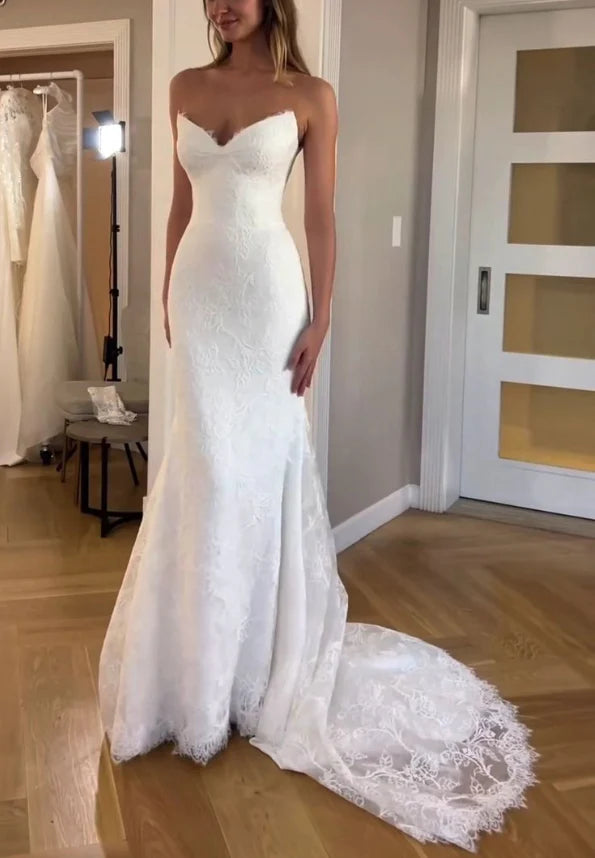 Back view of a model in a slim-fit lace mermaid bridal gown.