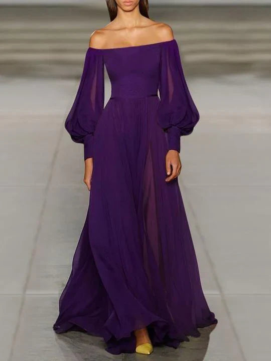 Model in a solid color strapless chiffon prom dress, highlighting flowing fabric and lantern sleeves.