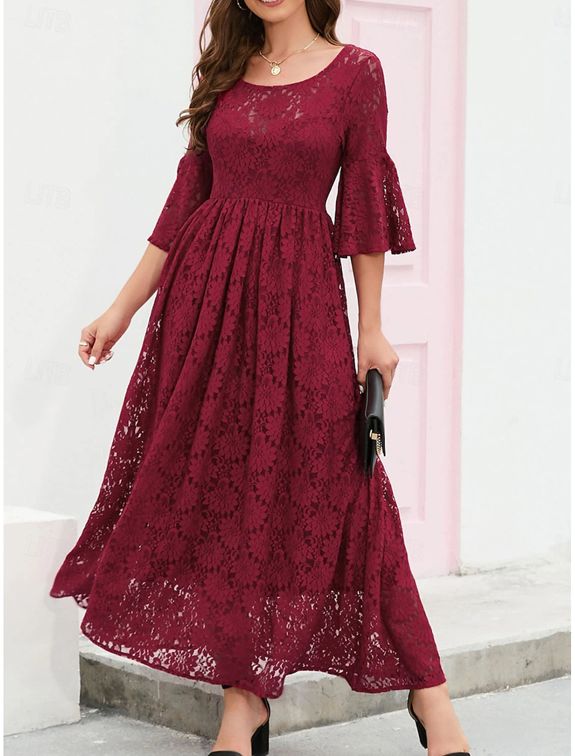Side view of the A-line lace dress, highlighting its silhouette.