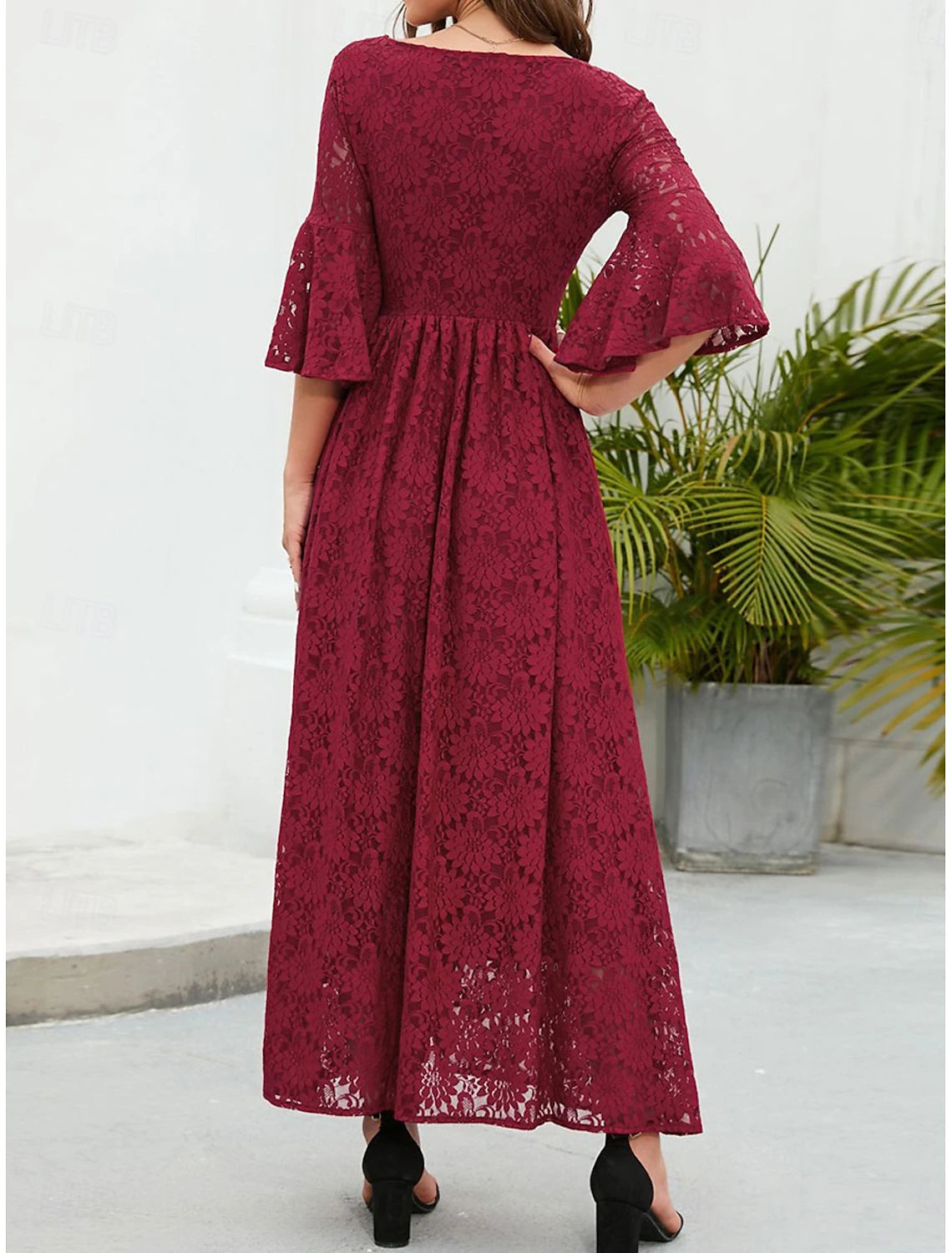 Back view of the A-line lace dress, showcasing the lace pattern.