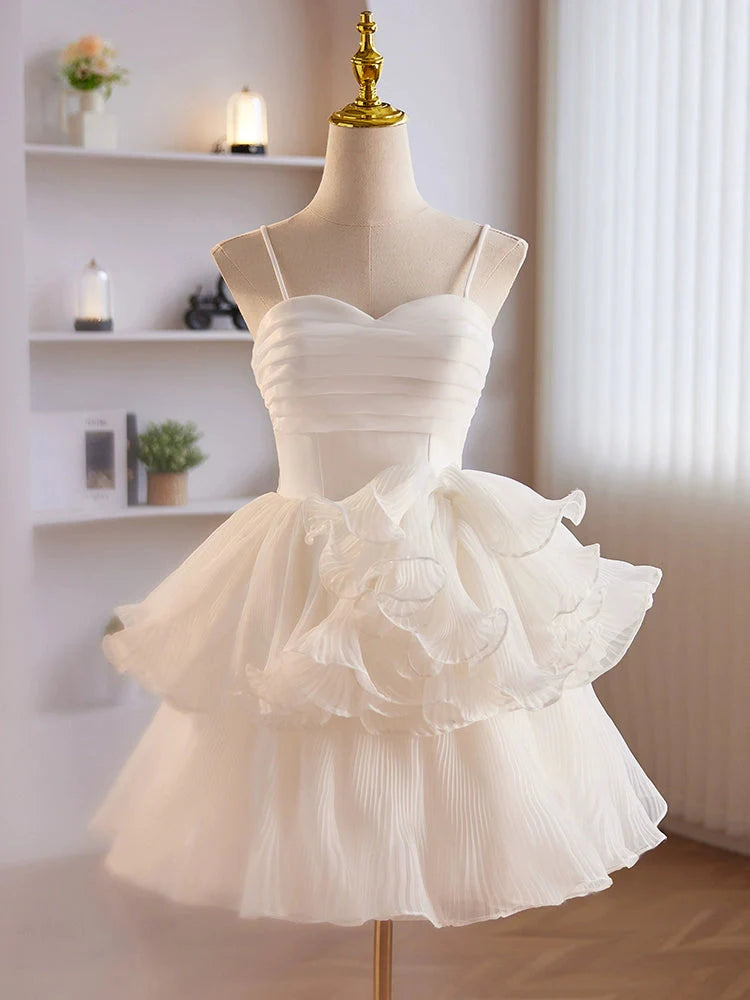 Model wearing an elegant white short organza prom dress with a sweetheart neckline.