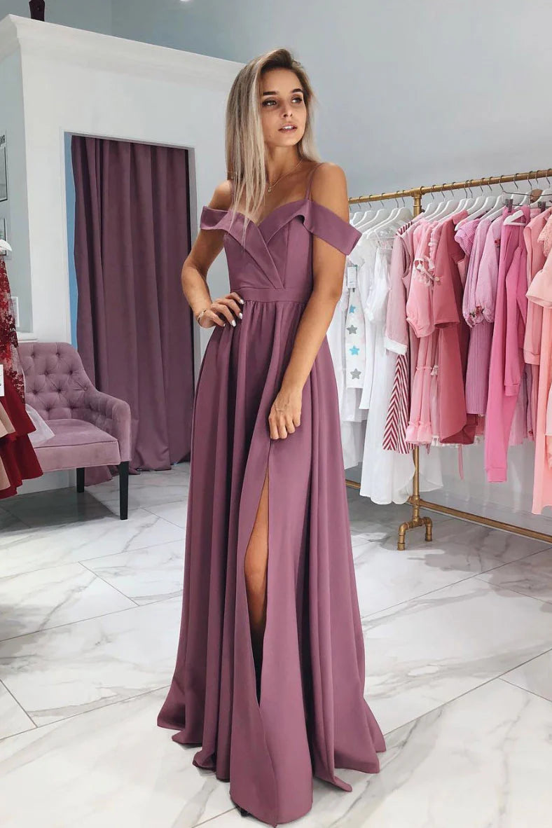 Woman wearing an elegant sweetheart off-shoulder long prom dress.