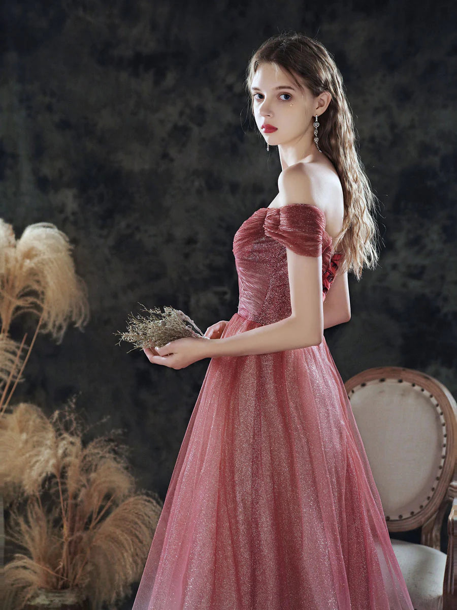 Back view of a shimmering burgundy off-shoulder sequin evening gown.