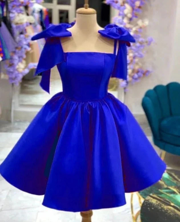 Elegant blue satin short dress with a delicate bow detail on the back.