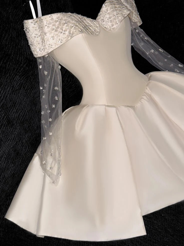 Back view of an off-shoulder lace and satin short homecoming dress, highlighting lace details.