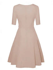 Side view of a woman in a stylish midi dress with a belted waist.