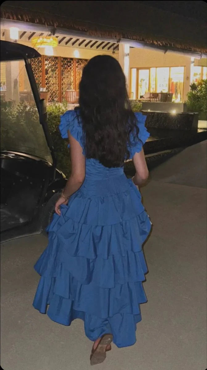 Side view of the elegant blue V-neck tiered evening gown.
