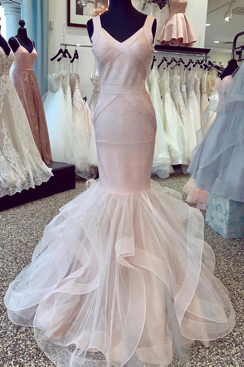 Woman wearing an elegant long tulle mermaid prom dress.