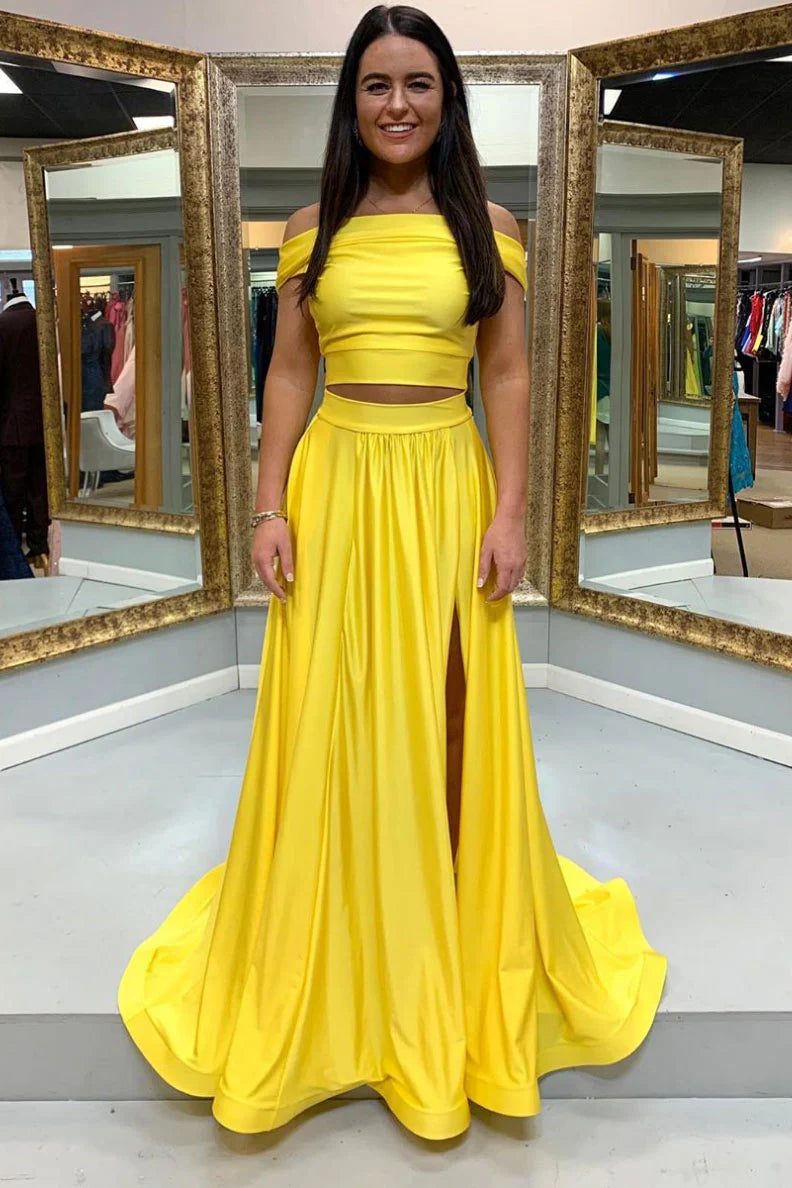 Model wearing an elegant yellow satin two-piece off-shoulder long prom dress.