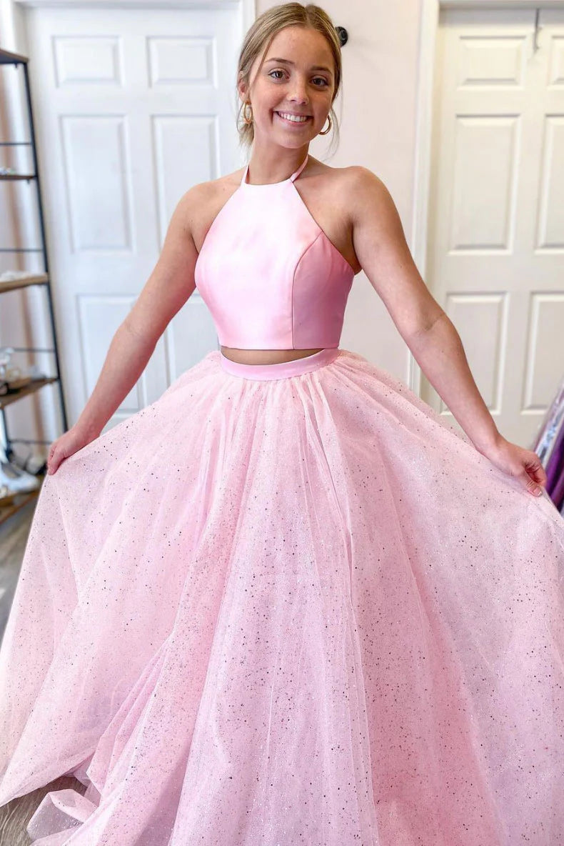 Elegant pink two-piece satin evening dress with a flattering waist detail.
