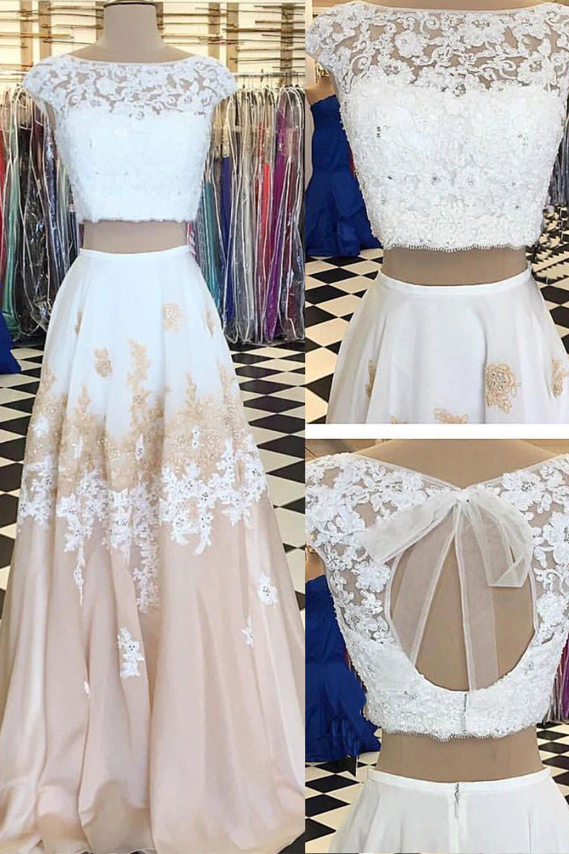 Woman wearing a light blue two-piece sweetheart chiffon lace long prom dress.