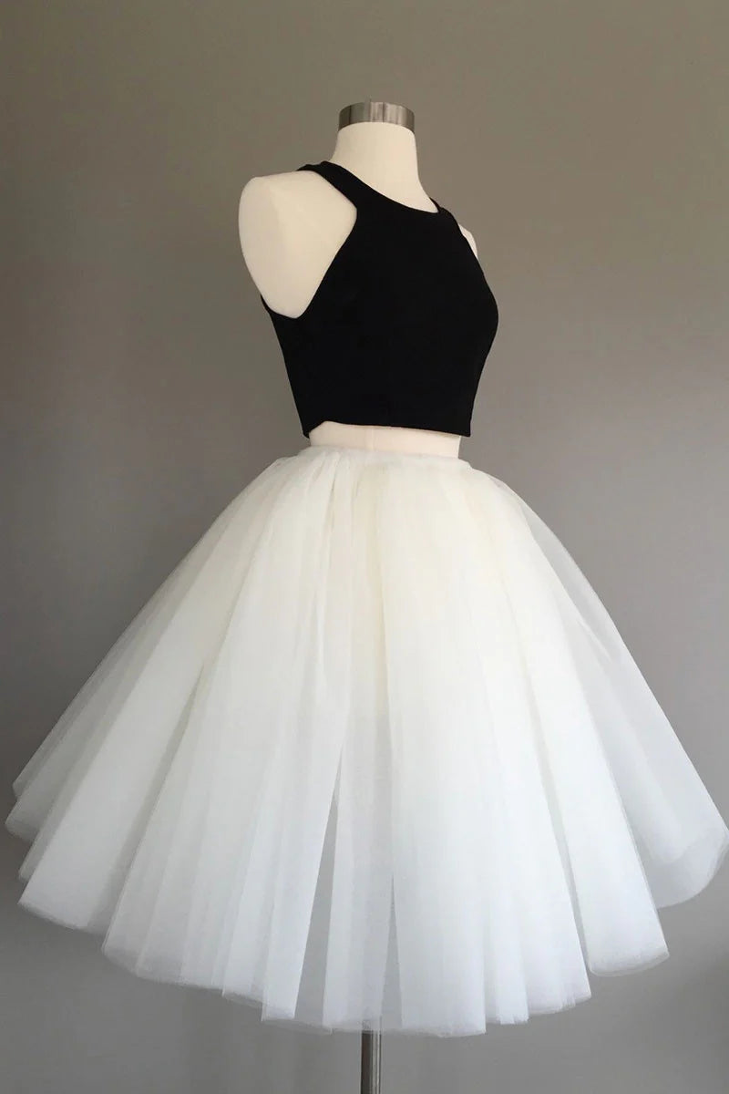 Back view of a model in a two-piece short tulle homecoming dress.