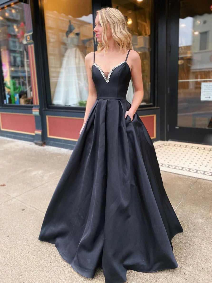 Model wearing an elegant black satin V-neck A-line long prom dress.