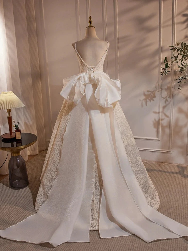 Front view of a light champagne lace long dress with intricate floral details.