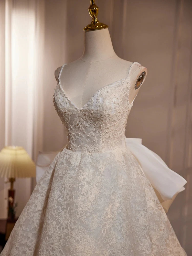 Back view of a flowing light champagne lace long dress, perfect for formal events.