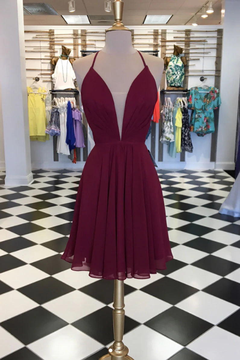 Model wearing an elegant burgundy short chiffon prom dress with a V-neck and lace-up back.