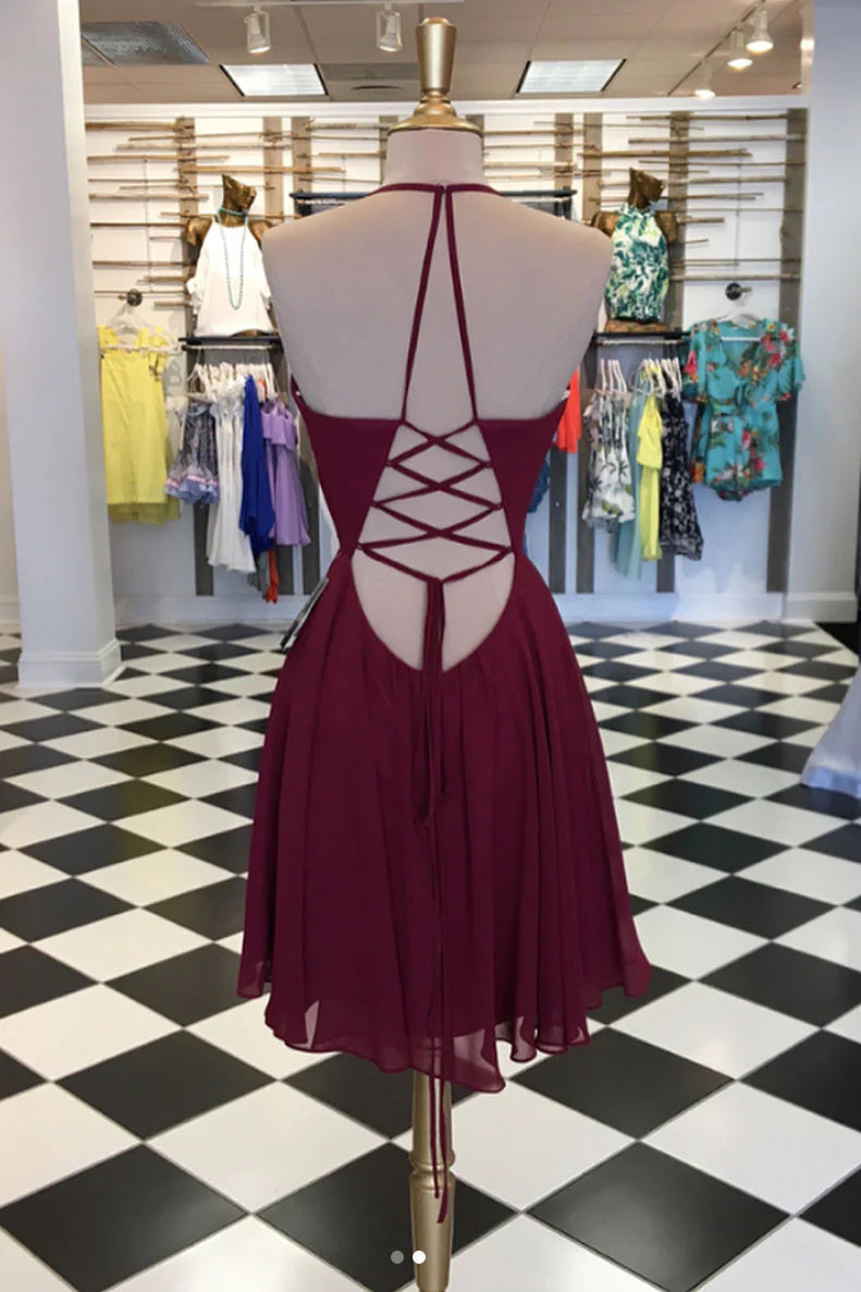 Back view of the burgundy short chiffon dress, highlighting the intricate lace-up detail.