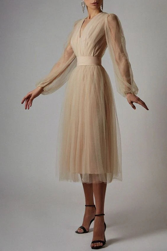 A woman showcasing the elegant drape of a sleeveless A-line prom dress.